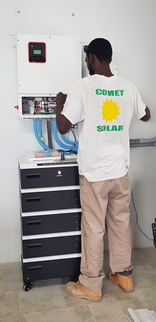 Comet Solar technician installing a battery storage system